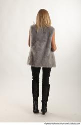 NIKOL STANDING POSE WITH SHOTGUN